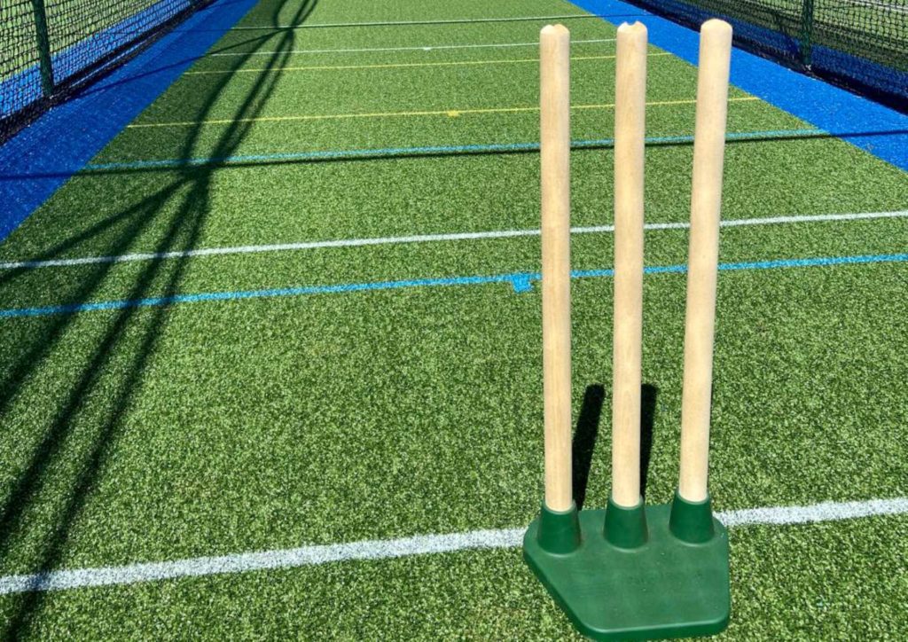 back garden cricket nets
Description: A zoomed view of the cricket stumps setup in an enclosed garden cricket net.