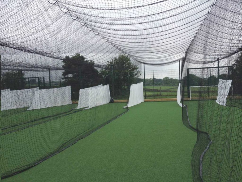 An image of a row of training nets for cricket practice