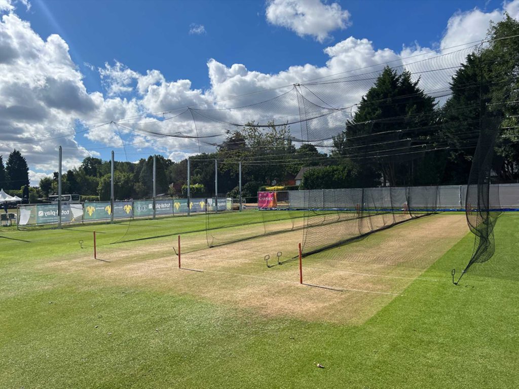 A view of cricket nets on a club ground
